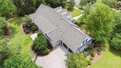 Step into timeless elegance in this beautifully crafted brick on Savannah Quarters Country Club in Georgia - for sale on GolfHomes.com, golf home, golf lot