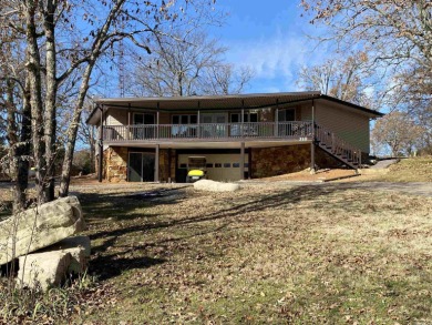This is a cute, remodeled house sitting on the edge of the on The Course At Turkey Mountain in Arkansas - for sale on GolfHomes.com, golf home, golf lot