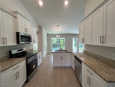 THIS BEAUTIFUL BRAND NEW ADAMS HOME IS MOVE IN READY AND WAITING on Kingsway Country Club in Florida - for sale on GolfHomes.com, golf home, golf lot