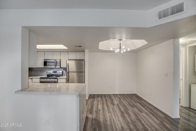 Enter to find living room w/vaulted ceilings flooded with on Stonecreek Golf Club in Arizona - for sale on GolfHomes.com, golf home, golf lot