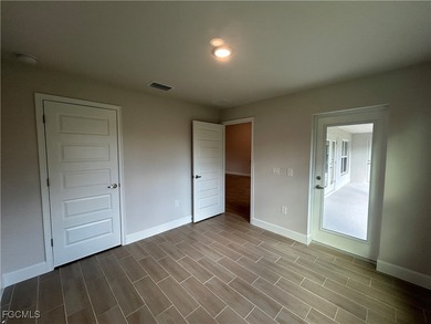 THIS BEAUTIFUL BRAND NEW ADAMS HOME IS MOVE IN READY AND WAITING on Kingsway Country Club in Florida - for sale on GolfHomes.com, golf home, golf lot