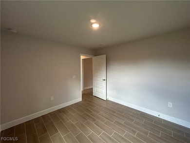 THIS BEAUTIFUL BRAND NEW ADAMS HOME IS MOVE IN READY AND WAITING on Kingsway Country Club in Florida - for sale on GolfHomes.com, golf home, golf lot