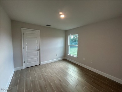 THIS BEAUTIFUL BRAND NEW ADAMS HOME IS MOVE IN READY AND WAITING on Kingsway Country Club in Florida - for sale on GolfHomes.com, golf home, golf lot