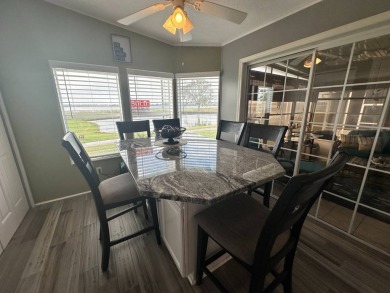 Discover your dream lifestyle in this stunning 3-bedroom, 2-bath on Four Lakes Golf Club in Florida - for sale on GolfHomes.com, golf home, golf lot