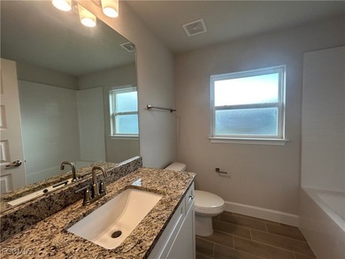 THIS BEAUTIFUL BRAND NEW ADAMS HOME IS MOVE IN READY AND WAITING on Kingsway Country Club in Florida - for sale on GolfHomes.com, golf home, golf lot