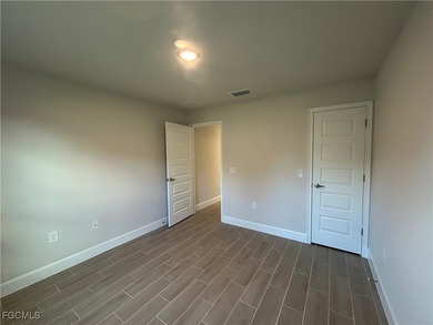 THIS BEAUTIFUL BRAND NEW ADAMS HOME IS MOVE IN READY AND WAITING on Kingsway Country Club in Florida - for sale on GolfHomes.com, golf home, golf lot