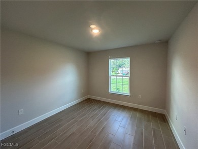 THIS BEAUTIFUL BRAND NEW ADAMS HOME IS MOVE IN READY AND WAITING on Kingsway Country Club in Florida - for sale on GolfHomes.com, golf home, golf lot