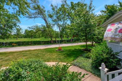 Situated on a tranquil street with picturesque views of the on Ravisloe Country Club in Illinois - for sale on GolfHomes.com, golf home, golf lot