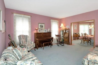 Situated on a tranquil street with picturesque views of the on Ravisloe Country Club in Illinois - for sale on GolfHomes.com, golf home, golf lot