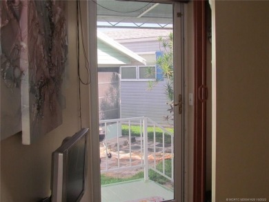 Come live the Florida lifestyle in this cozy, 1 bedroom, 1.5 on Island Dunes Country Club in Florida - for sale on GolfHomes.com, golf home, golf lot