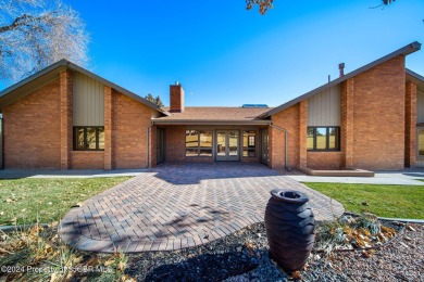 Nestled on fairway 7 of the San Juan Country Club, in Farmington on San Juan Country Club in New Mexico - for sale on GolfHomes.com, golf home, golf lot