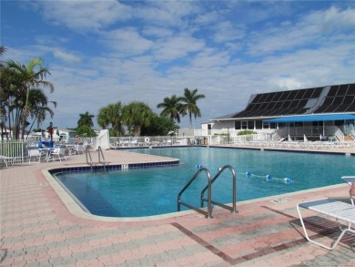 Come live the Florida lifestyle in this cozy, 1 bedroom, 1.5 on Island Dunes Country Club in Florida - for sale on GolfHomes.com, golf home, golf lot