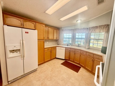 Home is located in Water Oak Country Club Estates in Lady Lake on Water Oak Country Club Estates in Florida - for sale on GolfHomes.com, golf home, golf lot