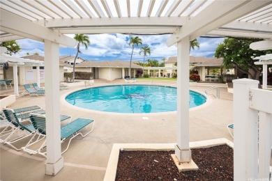 Behind the gates of The Arbors this ground floor townhome pairs on Ewa Villages Golf Course in Hawaii - for sale on GolfHomes.com, golf home, golf lot