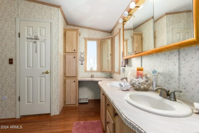 This meticulously maintained corner-lot manufactured home offers on Apache Creek Golf Club in Arizona - for sale on GolfHomes.com, golf home, golf lot