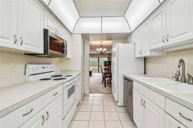 JUST REDUCED! Second floor 2/2 condo located in the highly on Cove Cay Country Club in Florida - for sale on GolfHomes.com, golf home, golf lot