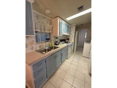 Discover Your Florida Oasis!    Welcome to your secret hideaway on Hamptons Golf Club in Florida - for sale on GolfHomes.com, golf home, golf lot