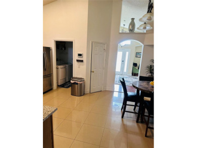 Step into radiant Florida living in the coveted Golf community on Wedgefield Golf Club in Florida - for sale on GolfHomes.com, golf home, golf lot
