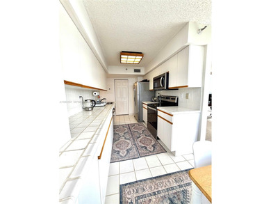 Experience refined luxury and stunning panoramic views in this on Turnberry Isle Resort and Club in Florida - for sale on GolfHomes.com, golf home, golf lot