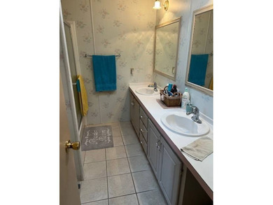 Spacious home in The Hamptons Golf & Country Club Resort on Hamptons Golf Club in Florida - for sale on GolfHomes.com, golf home, golf lot