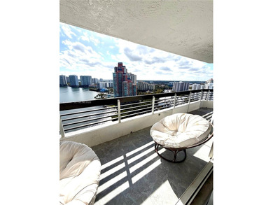 Experience refined luxury and stunning panoramic views in this on Turnberry Isle Resort and Club in Florida - for sale on GolfHomes.com, golf home, golf lot