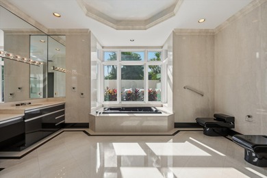 This Custom-built residence is thoughtfully designed to capture on The Loxahatchee Club in Florida - for sale on GolfHomes.com, golf home, golf lot