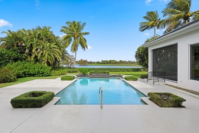 This Custom-built residence is thoughtfully designed to capture on The Loxahatchee Club in Florida - for sale on GolfHomes.com, golf home, golf lot