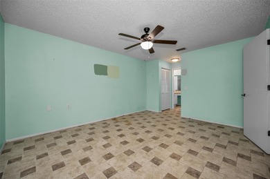 IN TIMBER GREENS A 55+ GATED GOLF COMMUNITY.....This 2-bedroom on Timber Greens Country Club in Florida - for sale on GolfHomes.com, golf home, golf lot