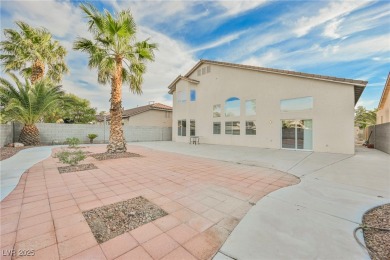 Experience refined living in this elegant 4-bedroom, 3-bath on Rhodes Ranch Golf Club in Nevada - for sale on GolfHomes.com, golf home, golf lot