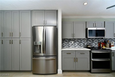 RARE FIRST FLOOR END VERANDA CONDO with den and garage located on Kelly Greens Golf and Country Club in Florida - for sale on GolfHomes.com, golf home, golf lot