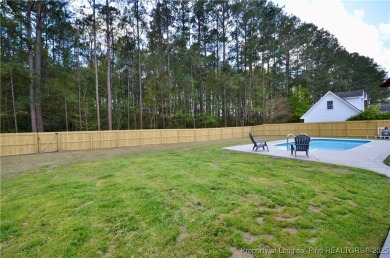 Immaculate home with over 2,000sqft w/an inground pool, located on Baywood Golf Club in North Carolina - for sale on GolfHomes.com, golf home, golf lot