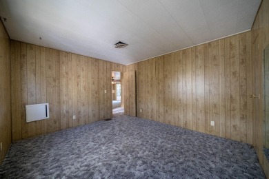 This is a 3 bedroom 2 bath manufactured home built in 1977 with on Churn Creek Golf Course in California - for sale on GolfHomes.com, golf home, golf lot