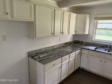 1400 square feet, 3 bed, 2 full bath brick home on Goldsboro on Goldsboro Municipal Golf Course in North Carolina - for sale on GolfHomes.com, golf home, golf lot