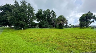 An incredible opportunity in Rotonda West. A canal frontage lot on Pinemoor West Golf Club in Florida - for sale on GolfHomes.com, golf home, golf lot