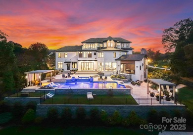 A one-of-a-kind modern masterpiece on Lake Norman. Crafted for on Trump National Golf Club Charlotte in North Carolina - for sale on GolfHomes.com, golf home, golf lot