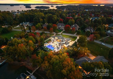 A one-of-a-kind modern masterpiece on Lake Norman. Crafted for on Trump National Golf Club Charlotte in North Carolina - for sale on GolfHomes.com, golf home, golf lot