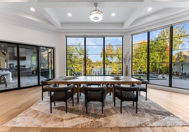 A one-of-a-kind modern masterpiece on Lake Norman. Crafted for on Trump National Golf Club Charlotte in North Carolina - for sale on GolfHomes.com, golf home, golf lot