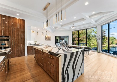 A one-of-a-kind modern masterpiece on Lake Norman. Crafted for on Trump National Golf Club Charlotte in North Carolina - for sale on GolfHomes.com, golf home, golf lot