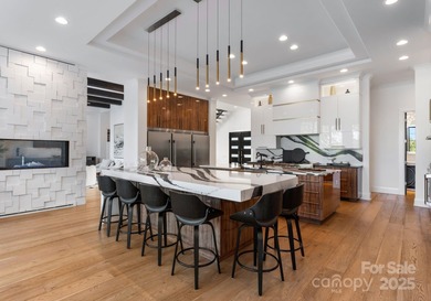 A one-of-a-kind modern masterpiece on Lake Norman. Crafted for on Trump National Golf Club Charlotte in North Carolina - for sale on GolfHomes.com, golf home, golf lot