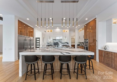A one-of-a-kind modern masterpiece on Lake Norman. Crafted for on Trump National Golf Club Charlotte in North Carolina - for sale on GolfHomes.com, golf home, golf lot