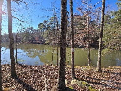 This Badin Lake waterfront lot is located in the prestigious on Old North State Club at Uwharrie Point Golf community in North Carolina - for sale on GolfHomes.com, golf home, golf lot