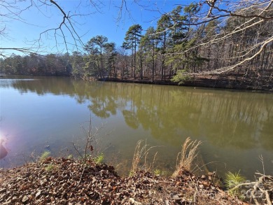 This Badin Lake waterfront lot is located in the prestigious on Old North State Club at Uwharrie Point Golf community in North Carolina - for sale on GolfHomes.com, golf home, golf lot