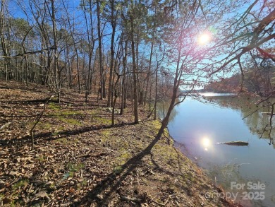 This Badin Lake waterfront lot is located in the prestigious on Old North State Club at Uwharrie Point Golf community in North Carolina - for sale on GolfHomes.com, golf home, golf lot