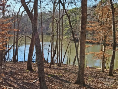 This Badin Lake waterfront lot is located in the prestigious on Old North State Club at Uwharrie Point Golf community in North Carolina - for sale on GolfHomes.com, golf home, golf lot