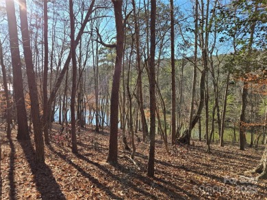 This Badin Lake waterfront lot is located in the prestigious on Old North State Club at Uwharrie Point Golf community in North Carolina - for sale on GolfHomes.com, golf home, golf lot