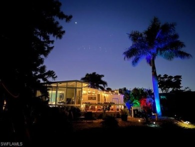 Enjoy outdoor entertaining? This home is tucked away on a on Riviera Golf Club in Florida - for sale on GolfHomes.com, golf home, golf lot