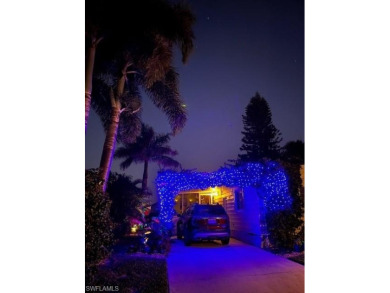 Enjoy outdoor entertaining? This home is tucked away on a on Riviera Golf Club in Florida - for sale on GolfHomes.com, golf home, golf lot
