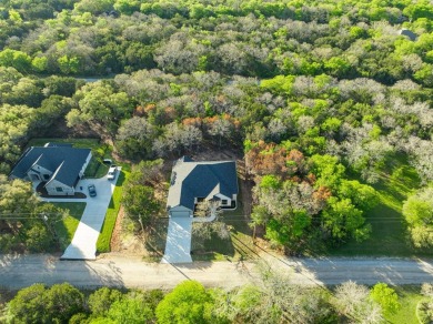 Beautiful home, has four bedrooms, three and half bathrooms. 2 on White Bluff Resort - New Course in Texas - for sale on GolfHomes.com, golf home, golf lot