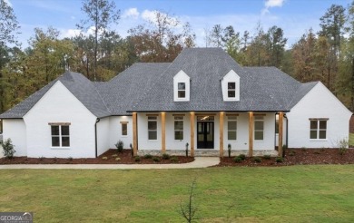 EXPERIENCE A PERFECT BLEND OF LUXURY, COMFORT, AND BREATHTAKING on Harbor Club Golf and Country Club in Georgia - for sale on GolfHomes.com, golf home, golf lot