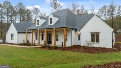 EXPERIENCE A PERFECT BLEND OF LUXURY, COMFORT, AND BREATHTAKING on Harbor Club Golf and Country Club in Georgia - for sale on GolfHomes.com, golf home, golf lot